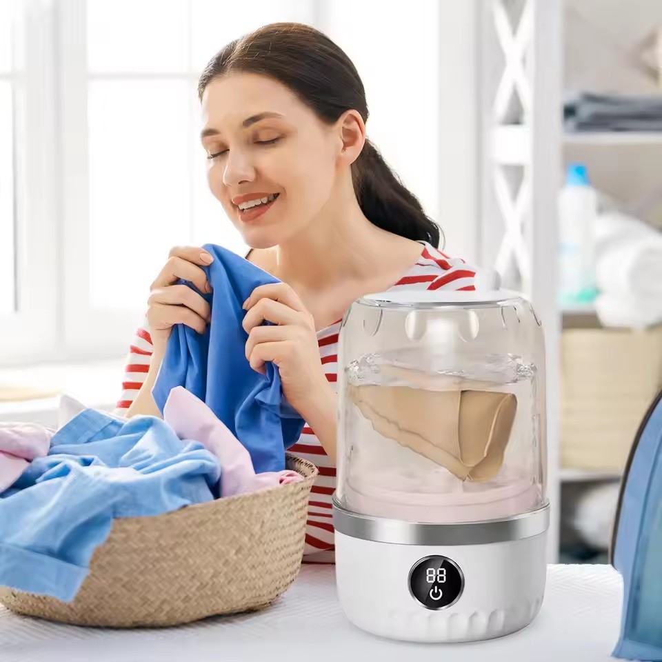 A compact 1L mini washing machine offering convenient small-load washing in a portable, space-saving design for home, dorm or travel use.